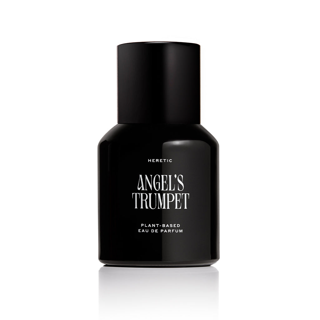 Black perfume bottle labeled 'Angel's Trumpet' by Heretic on a white background