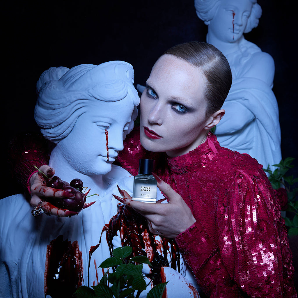 Model Holding Blood Berry