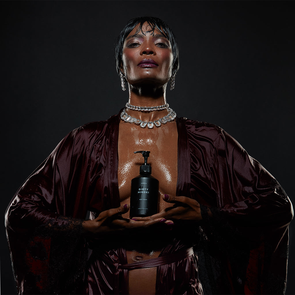 Model holding Dirty Hinoki body wash