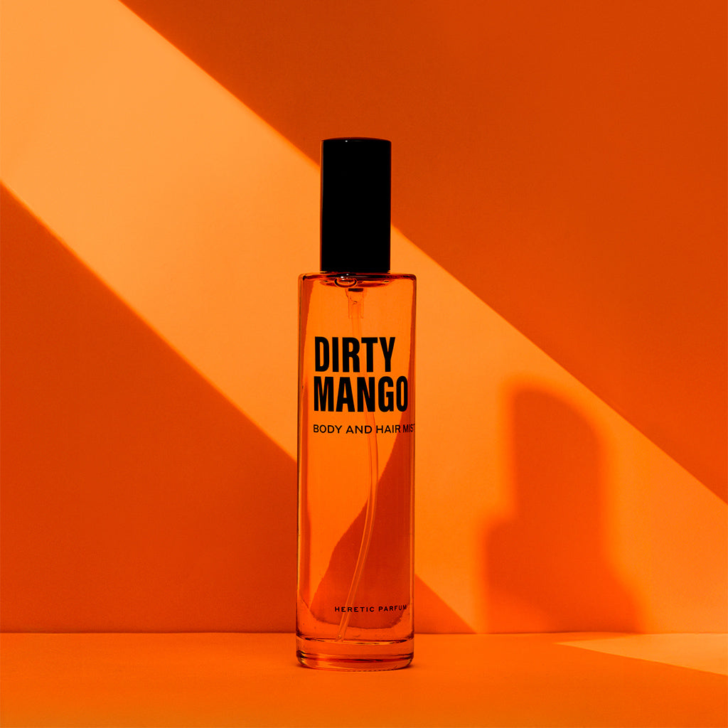 Dirty Mango bottle with light shining