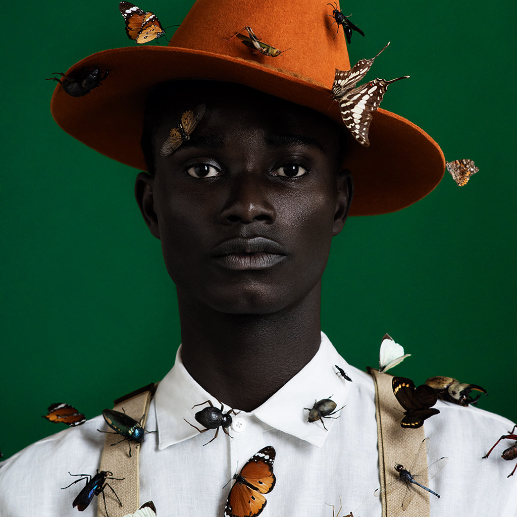 Man covered with insects