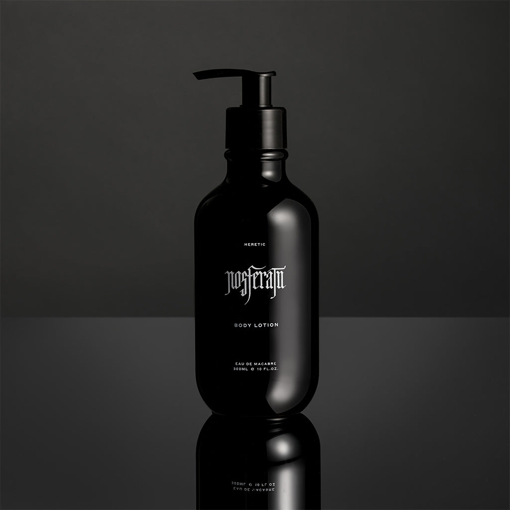 Black Nosferatu lotion bottle with pump on a reflective surface and dark background
