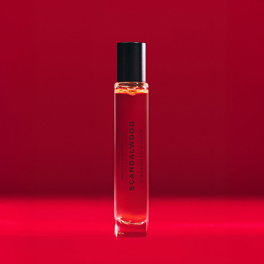 Scandalwood rollerball perfume on red