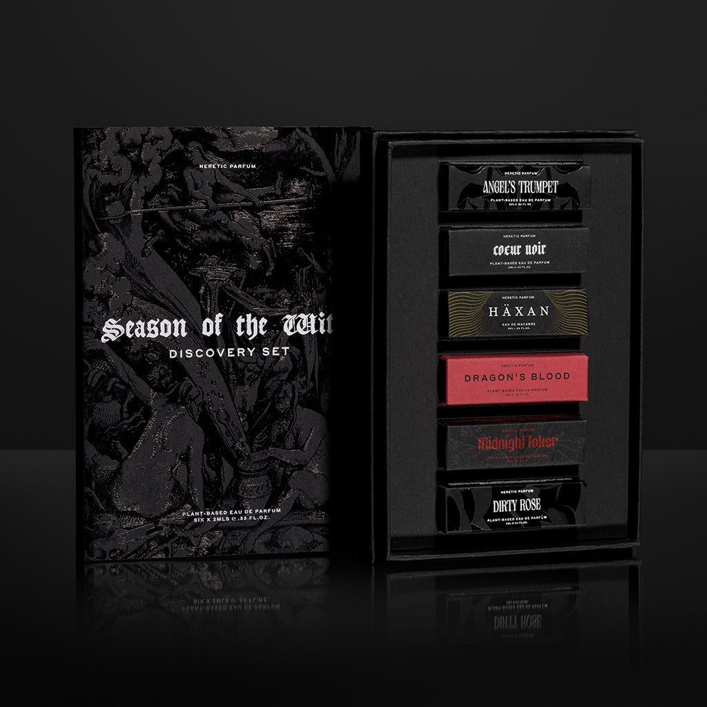 Perfume set packaging with labels on a dark background